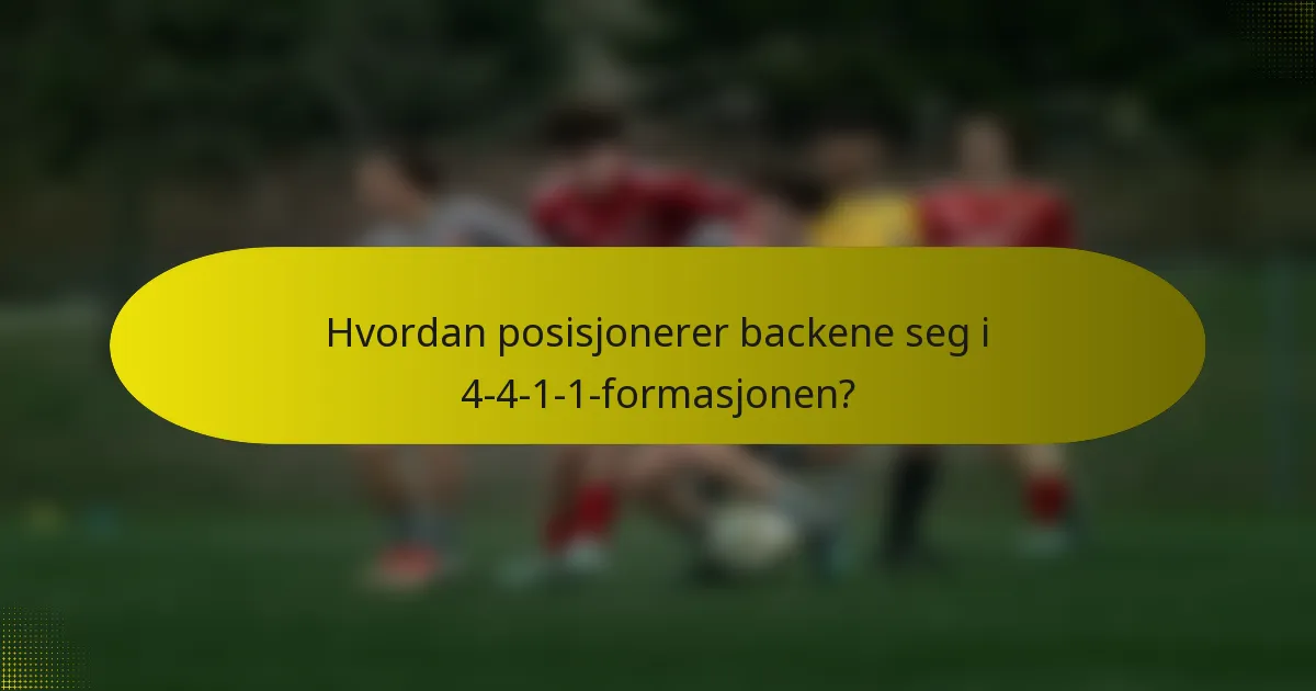 Hvordan posisjonerer backene seg i 4-4-1-1-formasjonen?